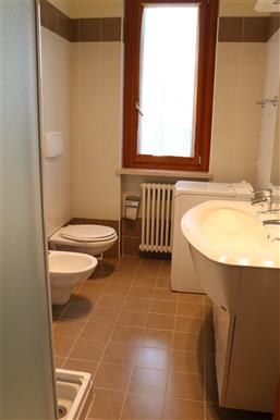 bathroom with shower and washing machine